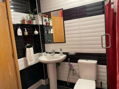 a small bathroom with a toilet and a sink at Majorelle Chillax in Marrakech