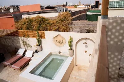 a swimming pool on the roof of a building at Riad Eden Dorient in Marrakech