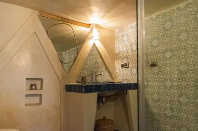 a bathroom with a shower and a sink and a mirror at Riad Moulaty 205m2 in der Medina mit Terrasse in Marrakech