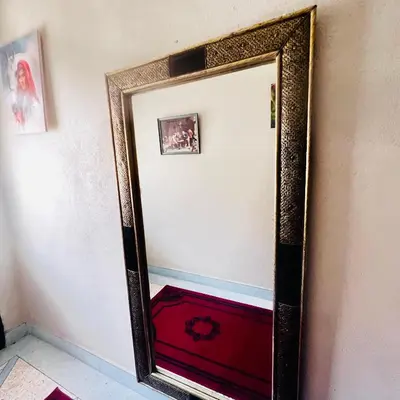 a mirror on a wall in a room at Cozy Apartment Near Airport Terminal Modern Apartment Close to Airport in Marrakech