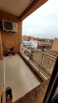 a balcony with a view of a city at appartement 29 entier avec balcon in Marrakech