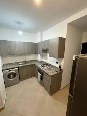 a kitchen with a sink and a stove top oven at Resort med 24t sikkerhet og basseng - nærme Gueliz in Marrakech