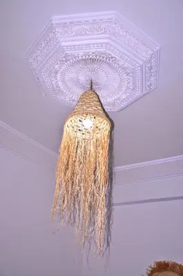 a chandelier hanging from a ceiling in a room at Riad Benrahal in Marrakech