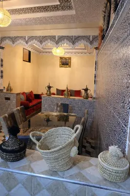 a living room with a couch and a table at appartement au cœur du Madina in Marrakech