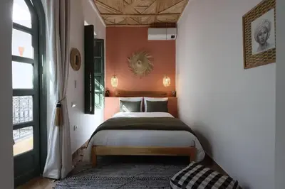 a bedroom with a large bed in a room at Riad Ptit Kech, Bassin terrasse - Petits déjeuners in Marrakech