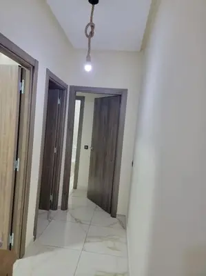 a hallway with three doors and a ceiling at Magnifique appartement luxueux à 10mn du centre in Marrakech