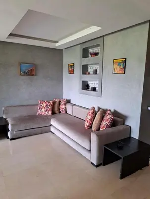 a living room with a couch and a table at Luxury 2 bedroom flat Center Marrakesh in Marrakech