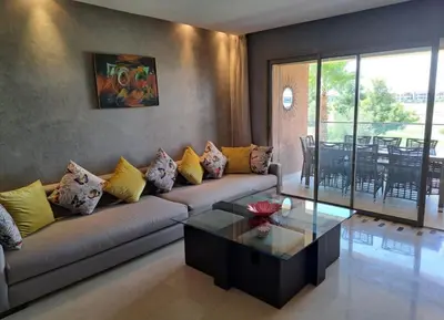 a living room with a couch and a table at Luxury 2 bedroom flat Center Marrakesh in Marrakech