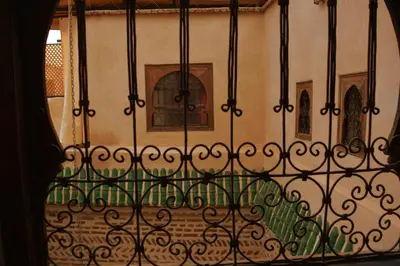 an iron fence in front of a building at Riad marrakesh peace in Marrakech
