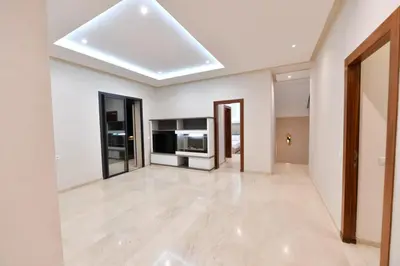 a large living room with white walls and a skylight at villa noria golf 4 chambres centre ville in Marrakech