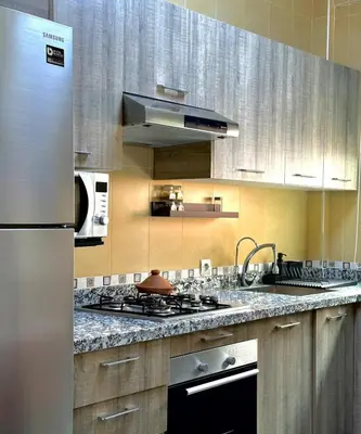a kitchen with a stainless steel stove top oven at Hosted by Zakia in Marrakech