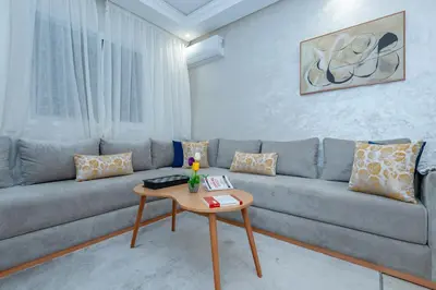 a living room with a couch and a table at New elegant apartment with 2 bedroom in Marrakech
