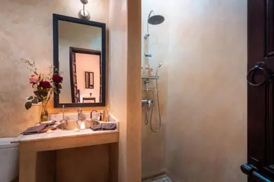 a bathroom with a sink and a mirror at Riad Dar Haris in Marrakech