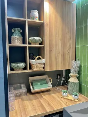 a kitchen with a shelf with bowls and baskets at Appartement Marrakech Hivernage N4 RESIDENCE CAPRICE PALACE in Marrakech