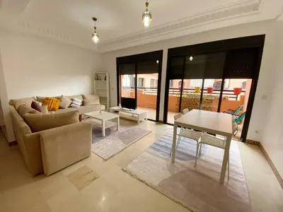 a living room with a couch and a table at Premium Stay in Marrakech