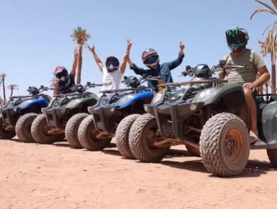 a group of people riding atvs on the beach at Premium Stay in Marrakech