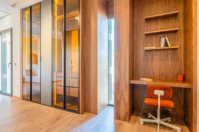 a home office with a orange chair in a hallway at Villa Talia, Luxury Stay, Golf & Lake View in Marrakech