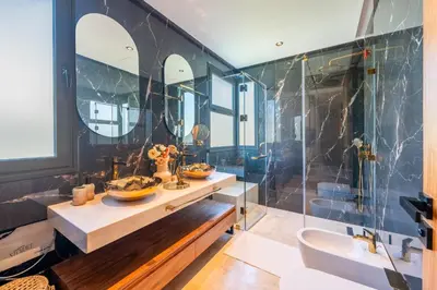 a bathroom with two sinks and a shower at Villa Talia, Luxury Stay, Golf & Lake View in Marrakech