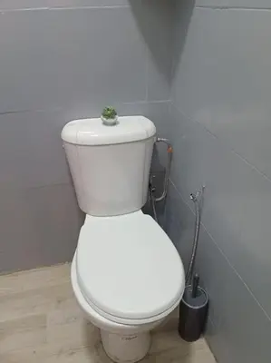 a bathroom with a white toilet in a room at appartement de luxe marrakech in Marrakech