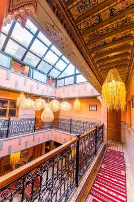 a large building with a large ceiling with chandeliers at Riad Almonds Marrakech in Marrakech