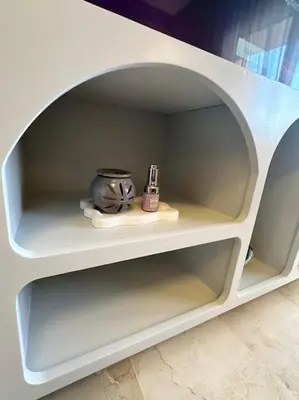 a white shelf with a bowl and a container on it at Appartement Cosy à Marrakech in Marrakech