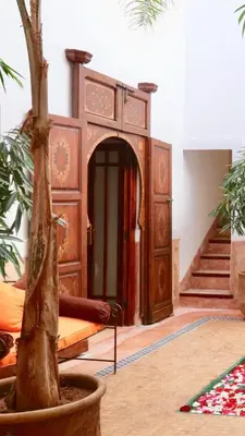 a room with a bed and a tree in a room at Authentique riad Emplacement exceptionnel in Marrakech