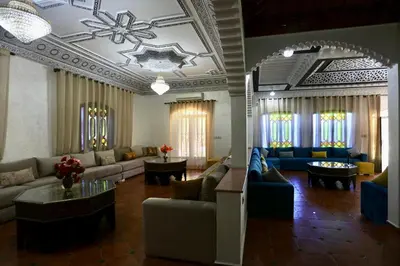 a large living room with couches and tables at Villa Les Terrasses Des Jardins in Marrakech
