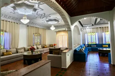 a large living room with couches and tables at Villa Les Terrasses Des Jardins in Marrakech