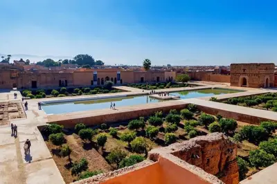 a view of a courtyard with two pools and trees at Maison d'hôtes Marrakech in Marrakech