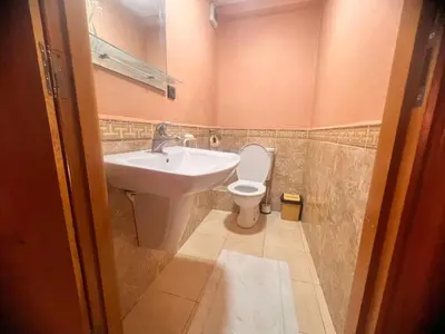 a bathroom with a sink and a toilet at prestige andalouse 4 in Marrakech