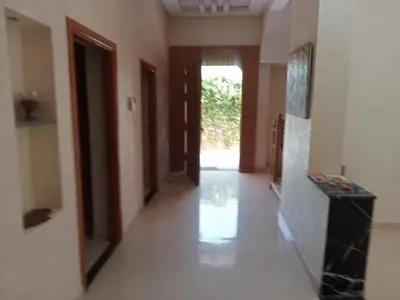 a hallway with a hallway leading to a door at golf amelkis médina 1 N 50 in Marrakech