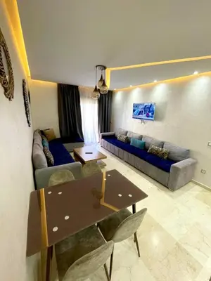a living room with a couch and a table at AMIZING Apartments Marrakech WAZO in Marrakech
