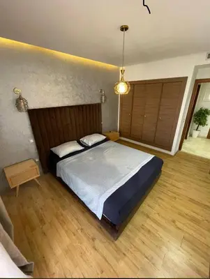 a bedroom with a large bed in a room at AMIZING Apartments Marrakech WAZO in Marrakech