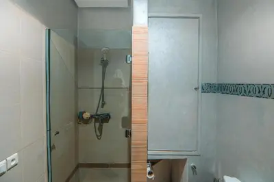 a shower with a glass door in a bathroom at Marrakech Garden Tropical Escape in Marrakech