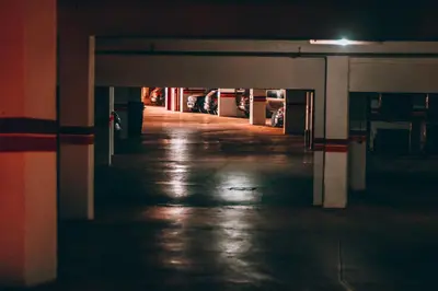 an empty parking garage at night with the lights on at Marrakech Garden Tropical Escape in Marrakech