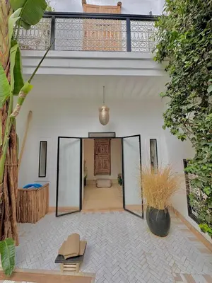 a large room with a hallway with a door at Riad privé luxe 3 chambres dans la médina de Marrakech y compris petit dejeuner in Marrakech