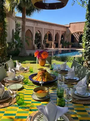 a table with plates of food on top of it at Dar Anacaona in Marrakech