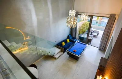 an overhead view of a living room with a blue couch at Duplexe Luxueux de 2 Suites in Marrakech