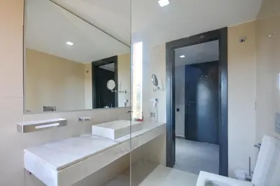 a bathroom with a sink and a mirror at Duplexe Luxueux de 2 Suites in Marrakech