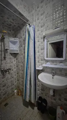 a bathroom with a sink and a mirror at Cyndi Home Gueliz \u72ec\u4eab\u6574\u5957\u516c\u5bd3 in Marrakech