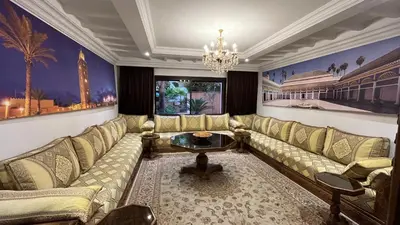 a living room with a couch and a table at Amazing apartment in the heart of Marrakesh in Marrakech