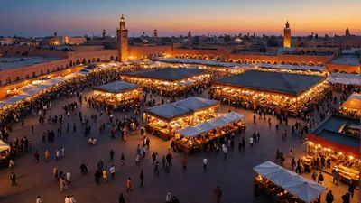 a group of people walking around a market at night at Amazing apartment in the heart of Marrakesh in Marrakech