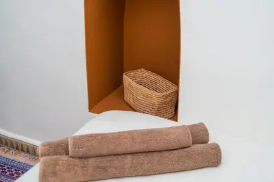a set of three towels next to a basket at Riad 3 chambres - petit déjeuner gratuit - Top position in Marrakech