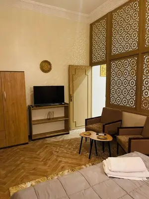 a living room with a couch and a table at Soleil de Medina in Marrakech