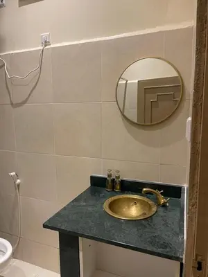 a bathroom with a sink and a mirror on a counter at Soleil de Medina in Marrakech