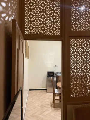 a room with a door and a kitchen with a table at Soleil de Medina in Marrakech