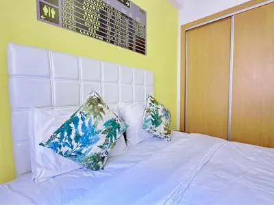 a white bed with two pillows on top of it at Apparemment in marrakech in Marrakech