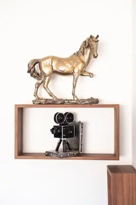 a statue of a horse on a shelf with a camera at Chic 2 Bedroom with Mountain views Gueliz in Marrakech