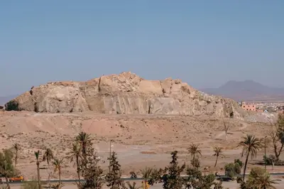 a rock formation in the middle of a desert at Luxury 2 Bedroom with Mountain View in Marrakech