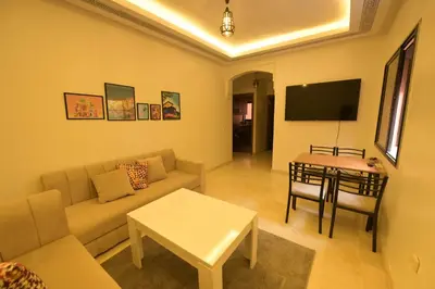 a living room with a couch and a table at Carisia Liam in Marrakech